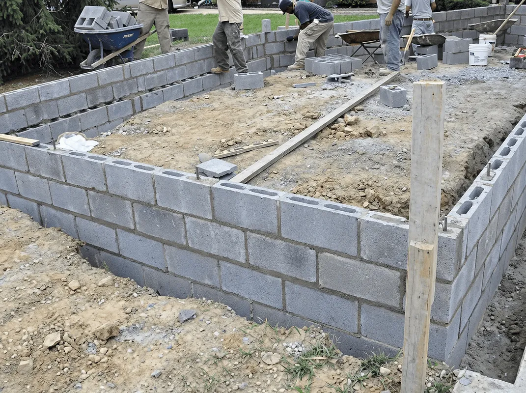 Professionals building a foundation with blocks in Naperville, IL