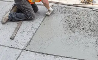 Professional repairing a concrete floor in Naperville, IL
